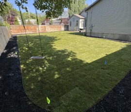 Complete backyard grading, Sprinklers, and new sod installation.