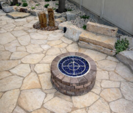 Flagstone Patio, Fire Pit, Flagstone step seat, Water Feature, Plants, Rocks, Rock Retaining wall